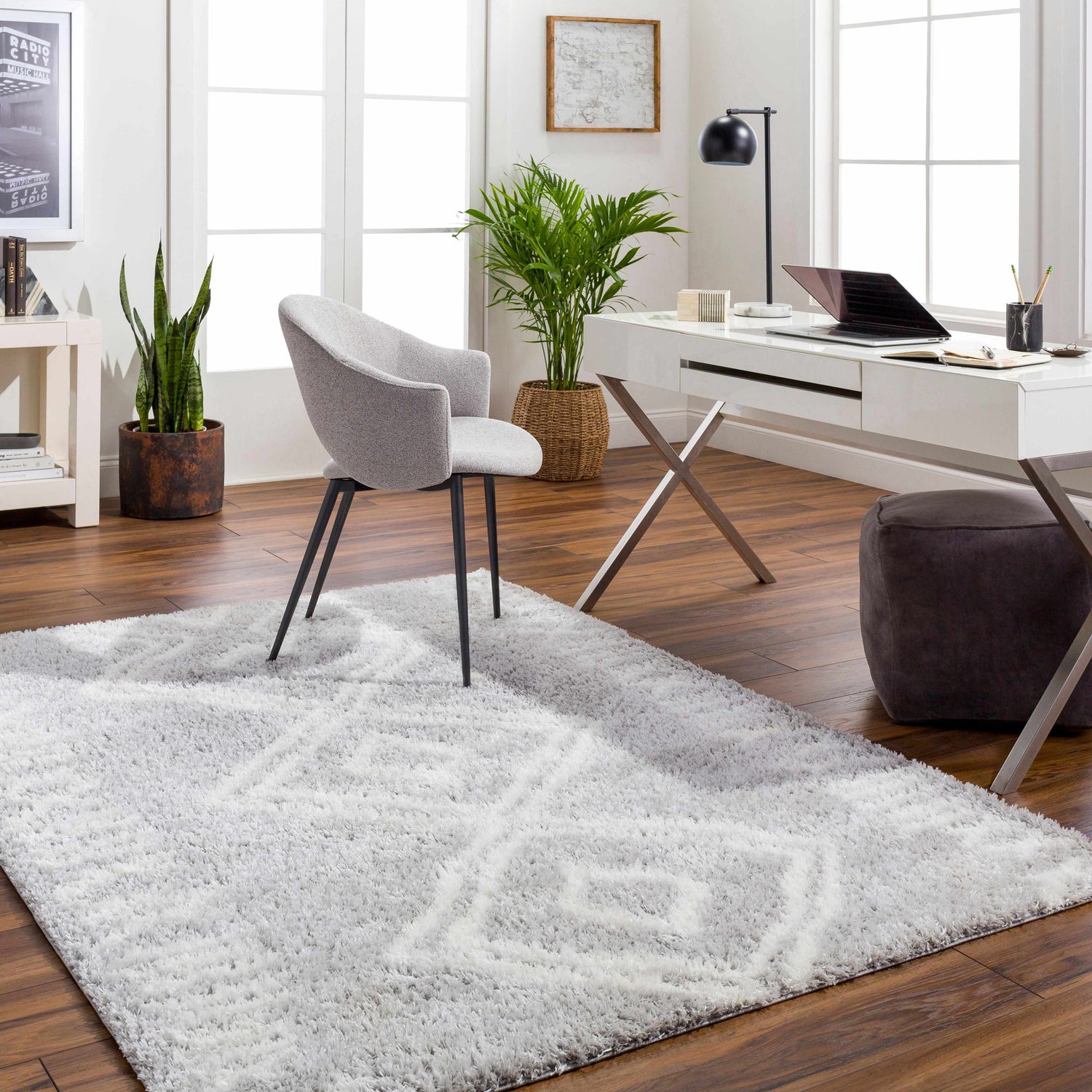 Bright home office with white desk, gray chair, and light gray Asael Gray Area Rug. Roomscene-Rectangle
