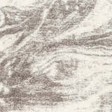 Close-up of the Delma Area Rug showing its shag texture and abstract pattern in cloud gray, dark gray, and off-white. Swatch