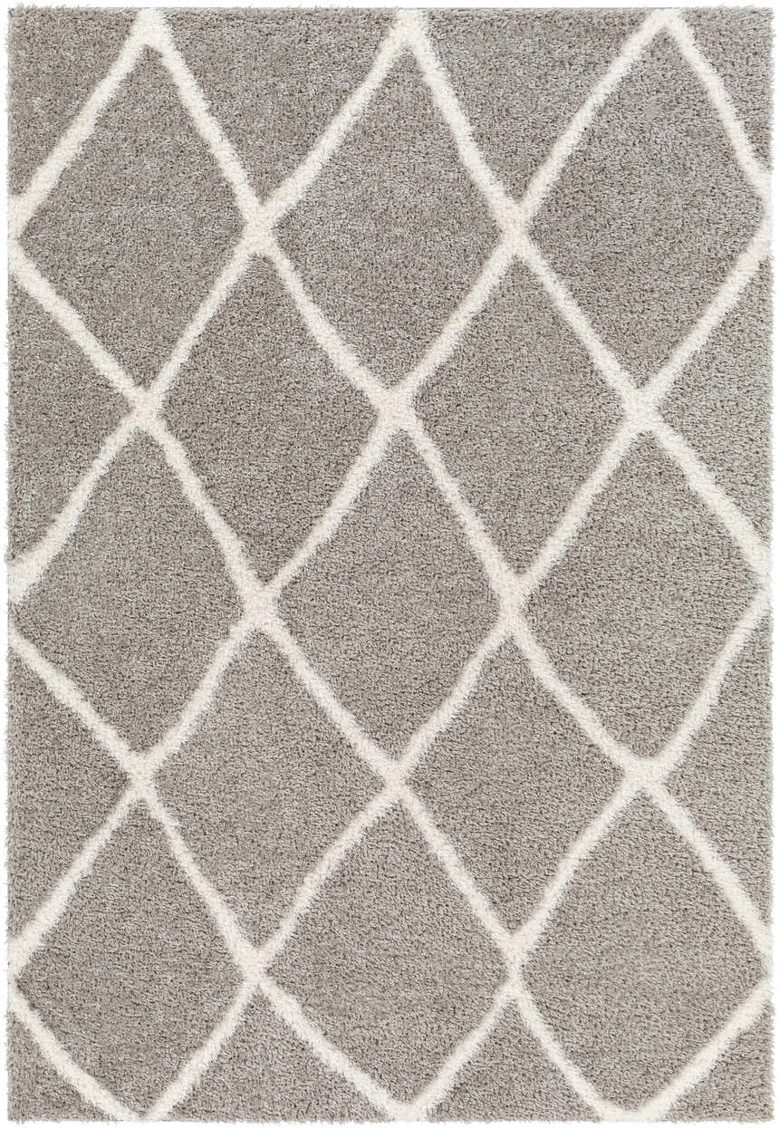 Close-up of the Faye Area Rug, featuring a charcoal shag texture and off-white geometric diamond pattern. Design-Rectangle-537
