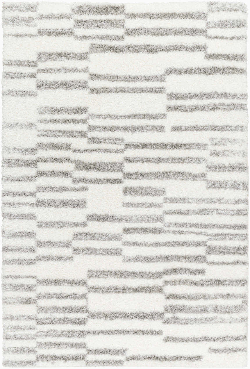 Close-up of a plush Kuron Area Rug with a contemporary gray and off-white geometric shag design. Design-Rectangle-537