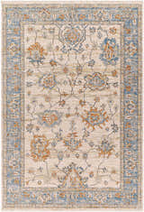 Detailed view of the Luma Area Rug, featuring a traditional floral pattern in faded driftwood, blue, and multi-brown tones. Design-Rectangle-537