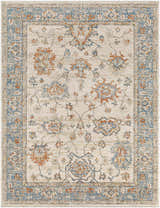 Close-up of the Luma Area Rug featuring a traditional floral pattern in faded driftwood, lambswool, blue, and multi-brown tones. Design-Rectangle-71010