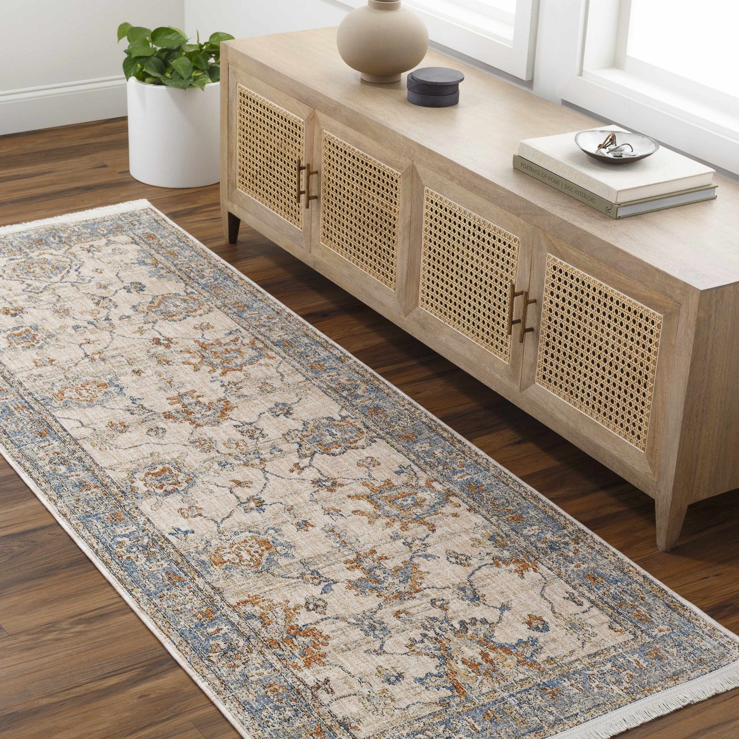 Hallway scene with Luma Area Rug runner in faded driftwood, blue, and brown tones. Farmhouse style console table. Roomscene-Runner