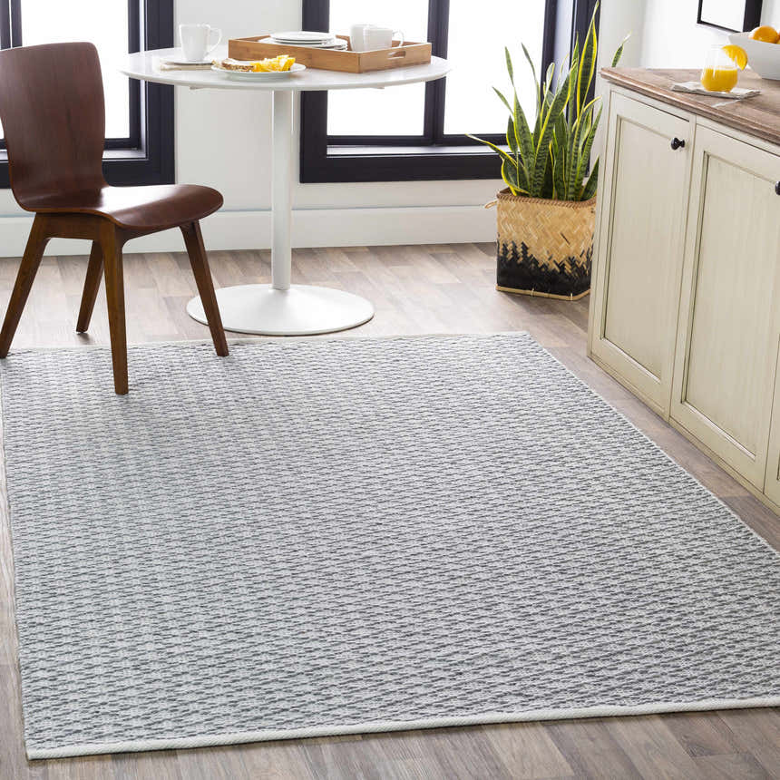 Bright kitchen scene with gray and white Scarborough Area Carpet, round table, and wood chair. Roomscene-Rectangle