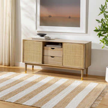 Living room scene with a striped beige and white Moby Area Rug under a wooden console table. Roomscene-Rectangle