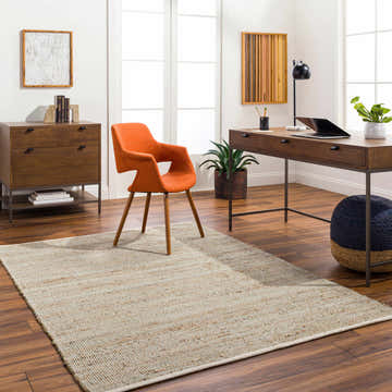 Bright home office with Byrne Beige & Green Jute Rug, wood desk, orange chair, and natural light. Roomscene-Rectangle