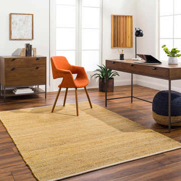Home office with Byrne Tan Area Rug, wood desk, orange chair, and dark wood dresser. Roomscene-Rectangle