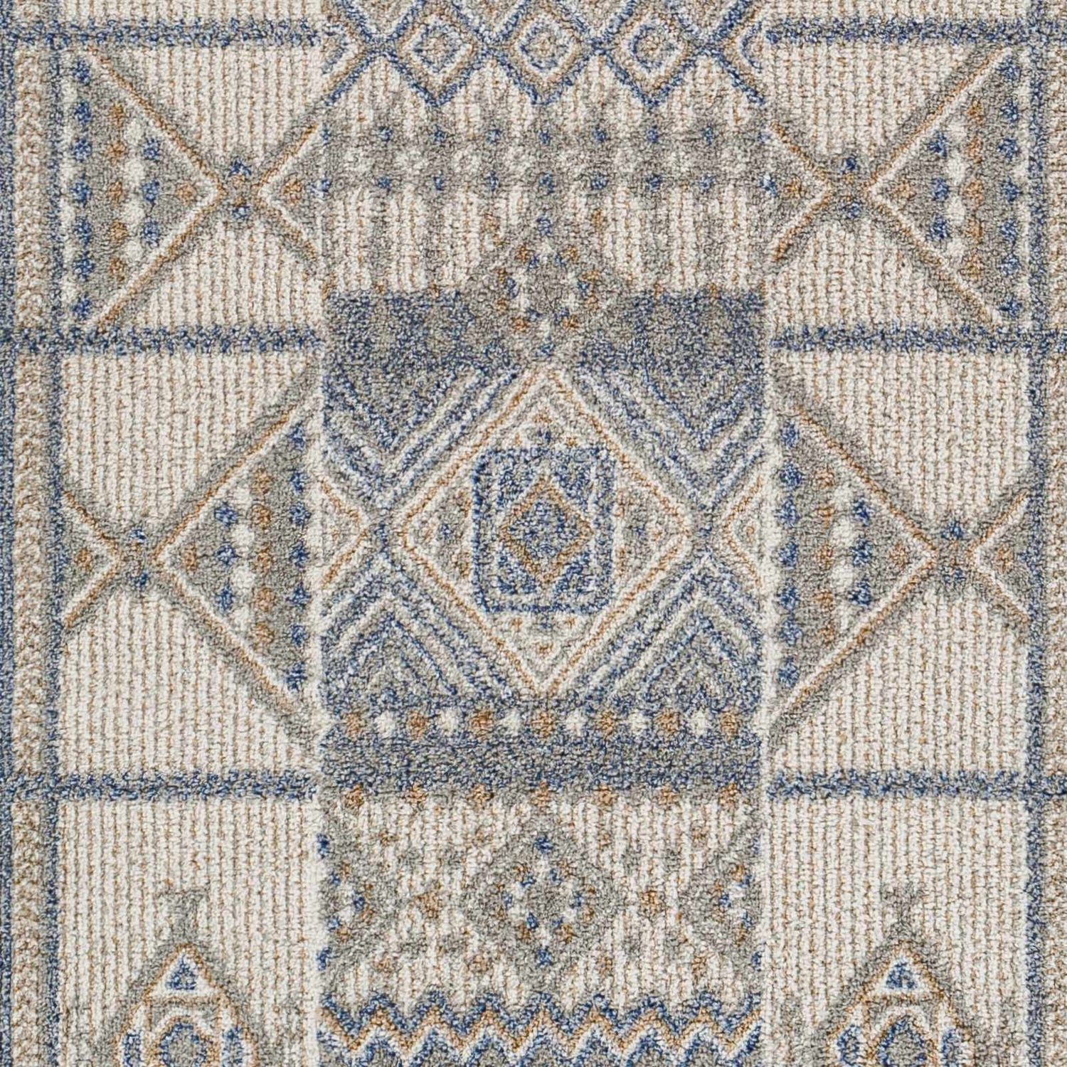 Close-up of Coryn Area Rug. Machine woven polypropylene rug with charcoal, gray, brown, and geometric Southwestern pattern. Swatch