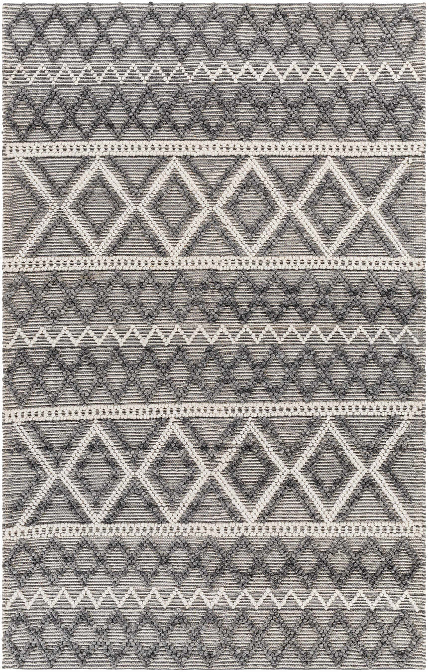 Close-up of the hand woven Yuka Area Rug. Dark gray and natural gray geometric pattern with textured recycled PET yarn. Design-Rectangle-576