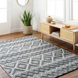 Entryway with a gray geometric Yuka Area Rug, wood floors, and a console table. Roomscene-Rectangle