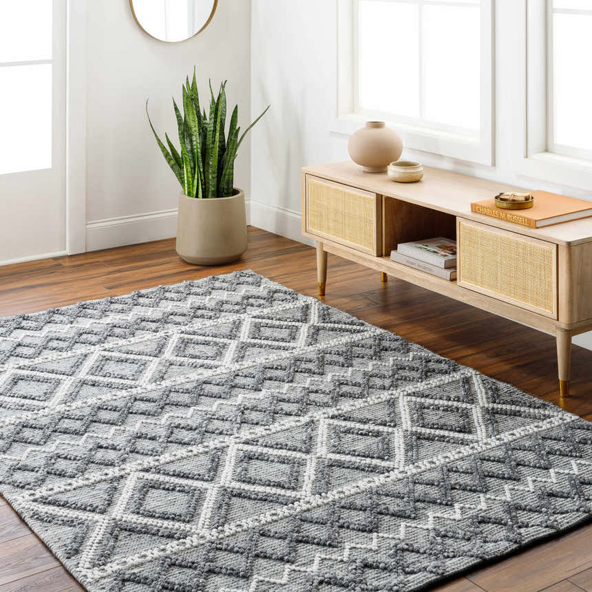 Entryway with a gray geometric Yuka Area Rug, wood floors, and a console table. Roomscene-Rectangle