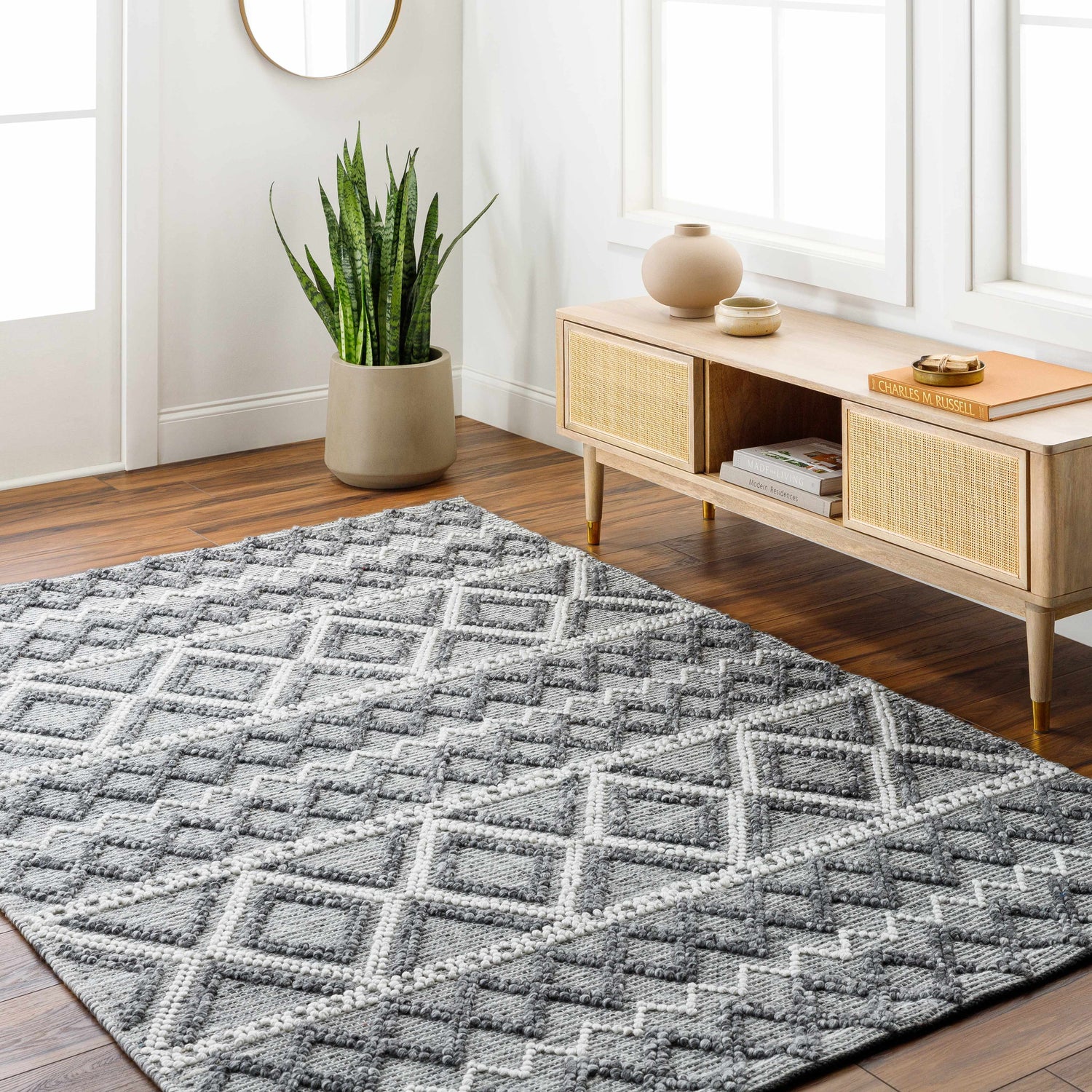 Entryway with a gray geometric Yuka Area Rug, wood floors, and a console table. Roomscene-Rectangle