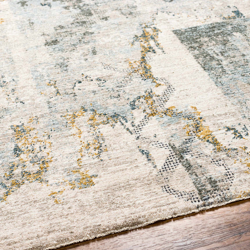 Close-up of the Adlai Textured Rug. Features a contemporary design with dusty sage, ink blue, and mustard accents. Texture