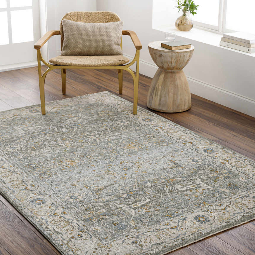 Living room scene with Aviva Teal Textured Rug, wood floors, woven chair, and side table. Roomscene-Rectangle