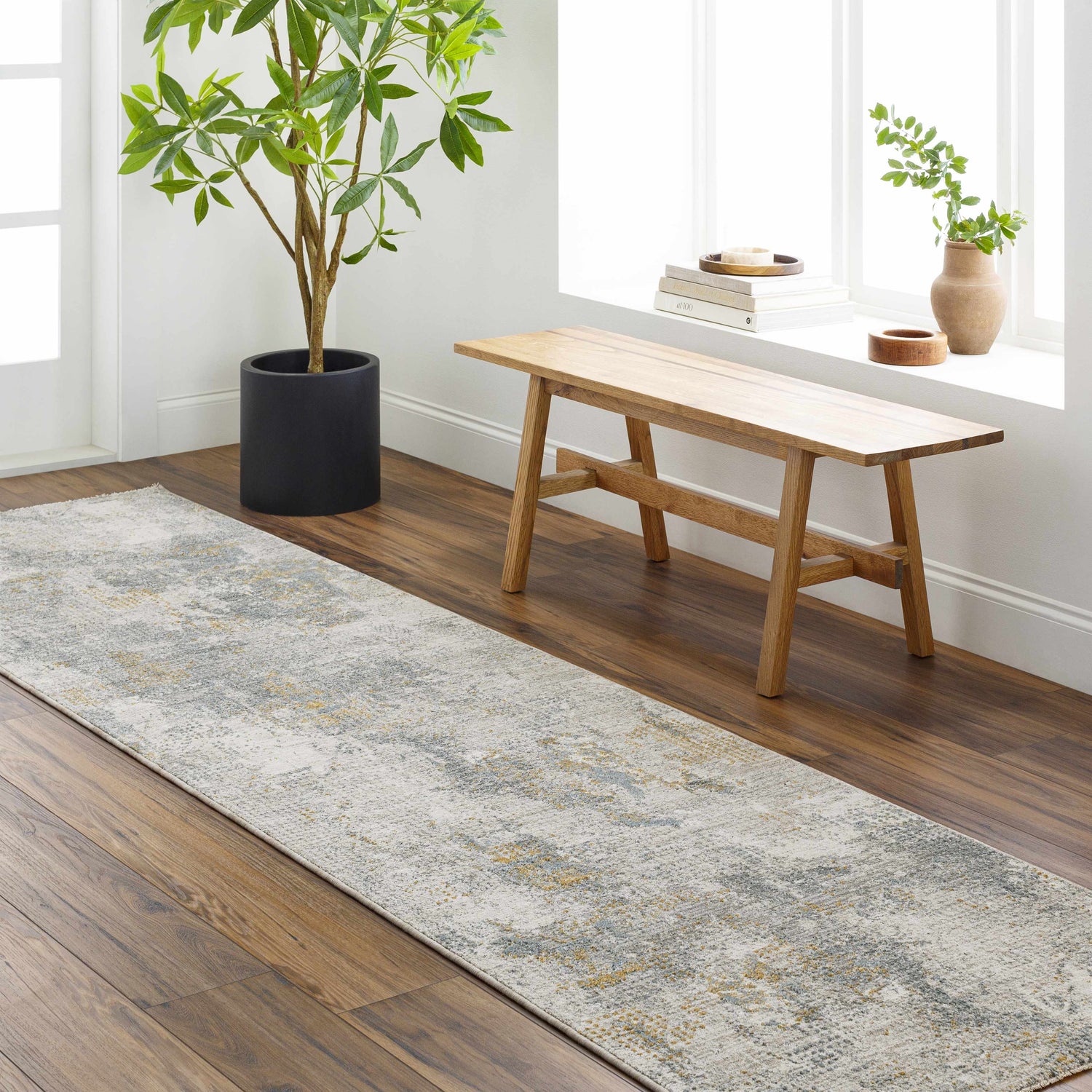Entryway with Haydn Rock Pattern Rug runner, wood floors, bench, and potted plant for a modern, inviting look. Roomscene-Runner
