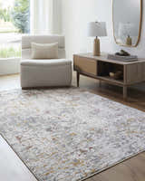 Living room scene with light gray Kasim Textured Rug, neutral armchair, and mid-century modern console table. Roomscene-Rectangle