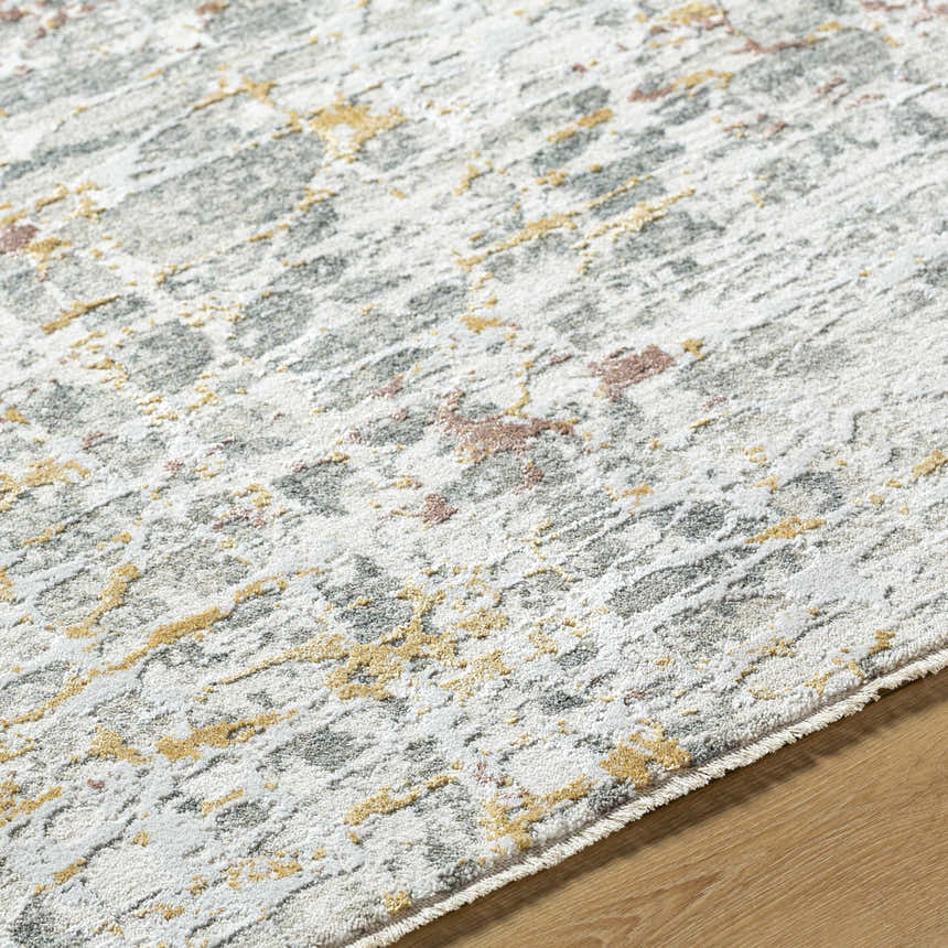 Close-up of the Kasim Textured Rug. Light gray rug with gold and blush accents. Contemporary style. Texture