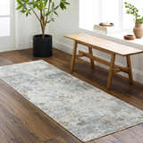 Entryway with Pizi Textured Rug runner in light gray, blue, and mustard. Wood bench and potted plant create a welcoming space. Roomscene-Runner
