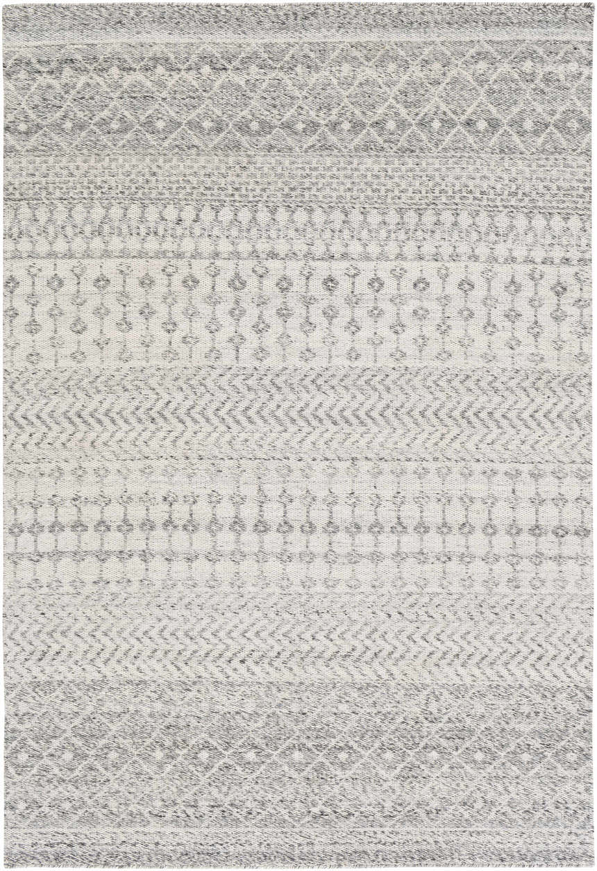 Close-up of the Seafield Indoor Outdoor Rug. Gray, off-white, and slate blue bohemian pattern. Hand woven texture. Design-Rectangle-576