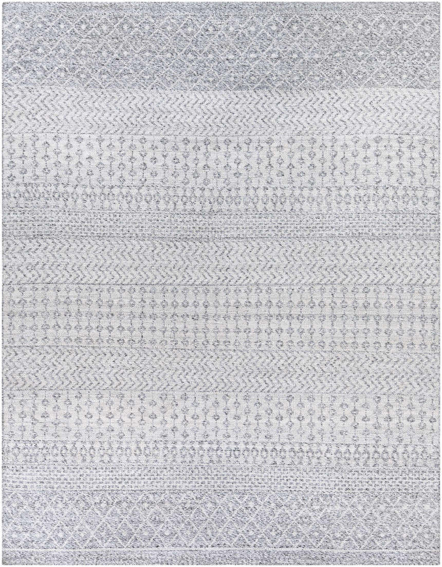Close-up of the Seafield Indoor Outdoor Rug. Gray, off-white, and blue hues with a woven bohemian pattern. Design-Rectangle-810
