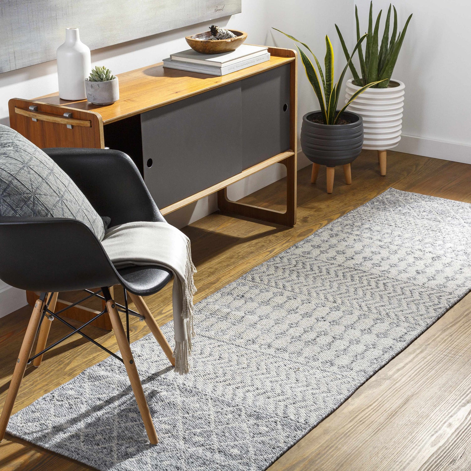 Entryway with mid-century console, chair, and gray Seafield Indoor Outdoor Rug runner. Plants add a fresh, modern touch. Roomscene-Runner
