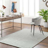 Home office with wood desk, gray chair, and light gray Ayumi Area Rug with subtle geometric pattern. Roomscene-Rectangle