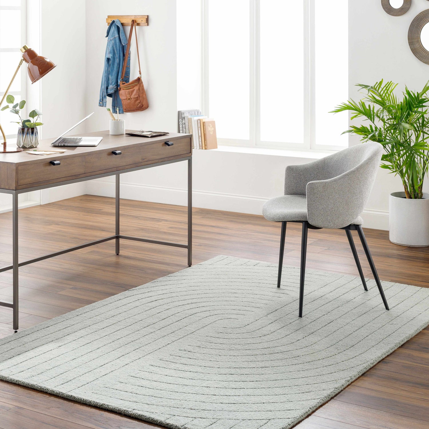 Home office with wood desk, gray chair, and light gray Ayumi Area Rug with subtle geometric pattern. Roomscene-Rectangle