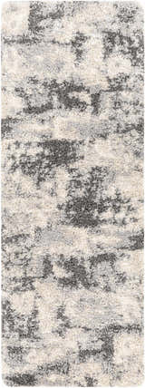 Close-up of the Selcuklu Area Rug. Black, cream, and light gray shag rug with a contemporary abstract pattern. Design-Runner-2773