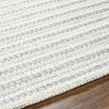 Close-up of the hand woven Laleh Gray Area Rug showing beige and rose cream stripes and wool texture. Texture