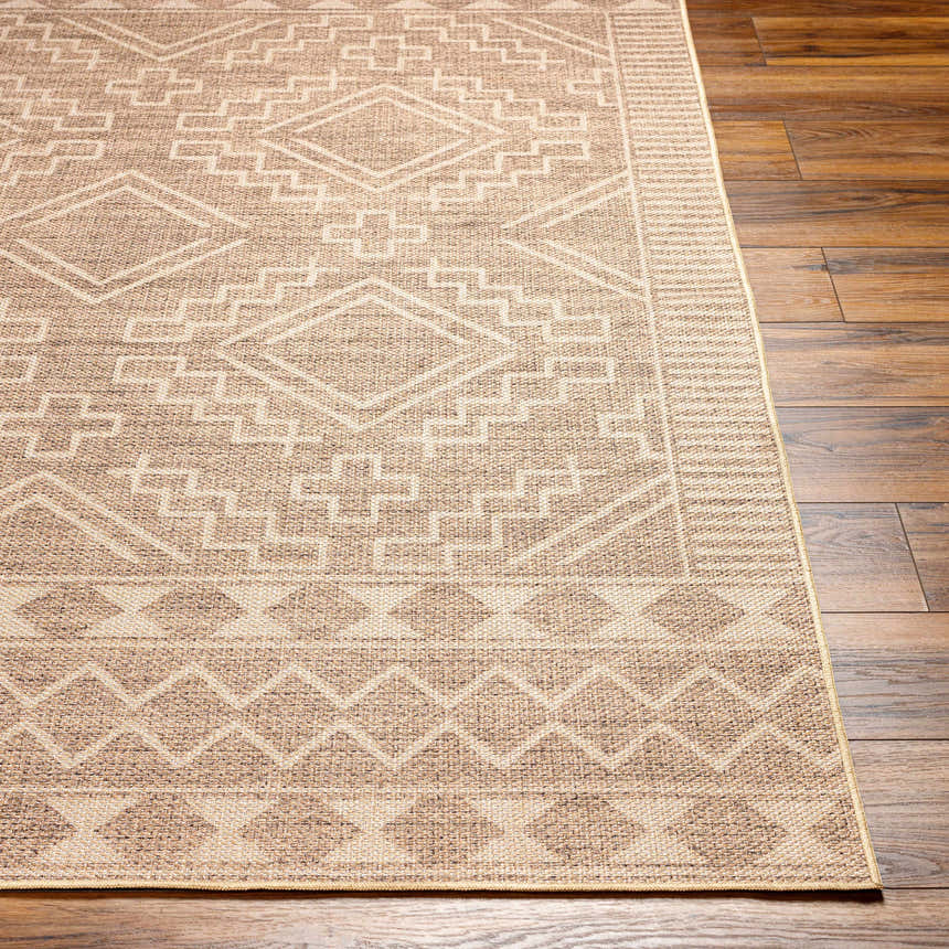 Close-up of Halle Beige Washable Area Rug showing geometric pattern and neutral colors on dark brown wood flooring. Front