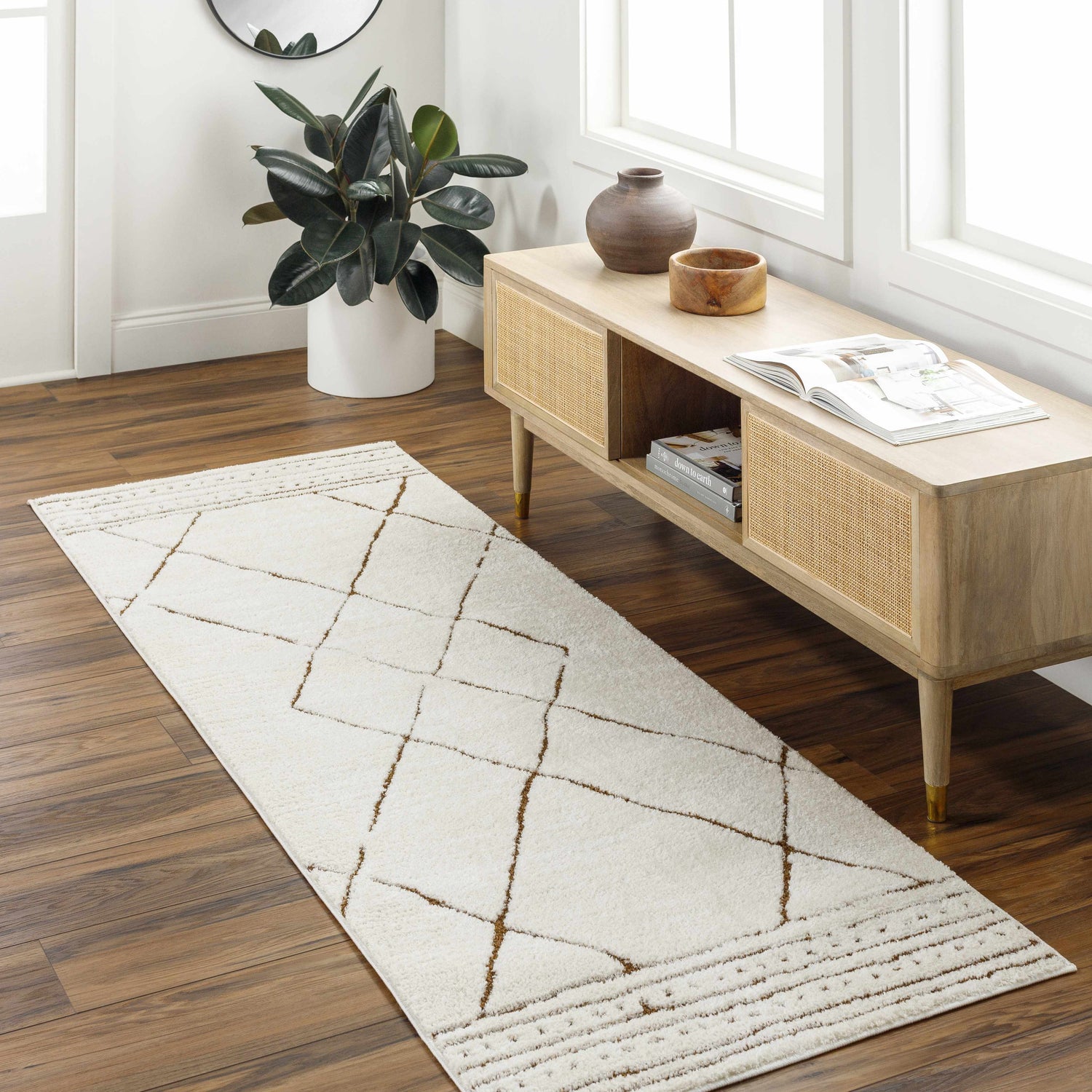 Entryway scene with beige Keone Area Rug, light wood console table, and dark wood floors. Roomscene-Runner