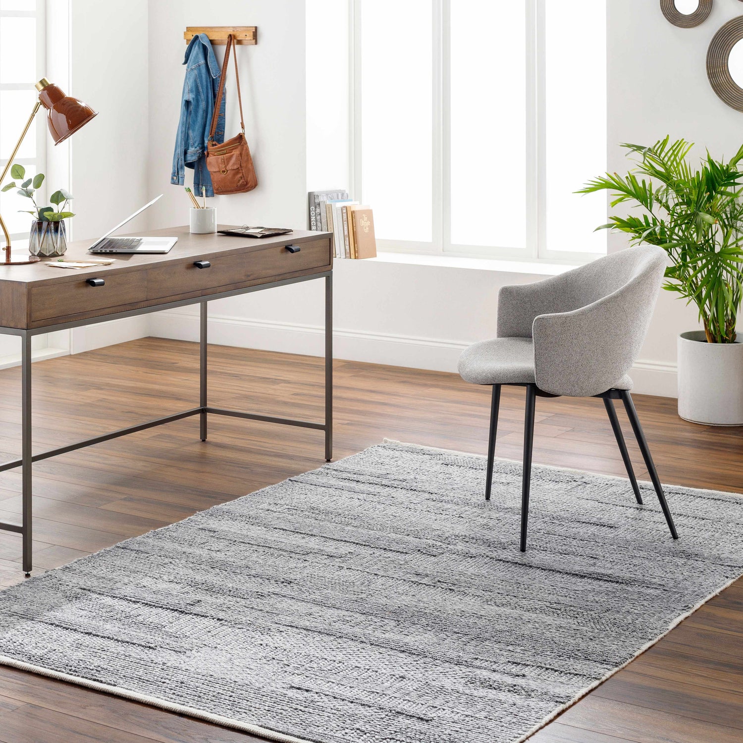 Home office with wood desk, gray chair, and textured gray Chepe Area Rug. Roomscene-Rectangle