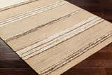 Close-up of the Arnie Area Rug showing beige, ivory, and brown stripes on dark wood floors. Hand woven texture. Corner