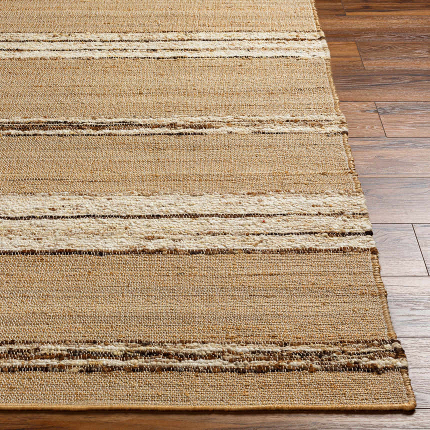 Close-up of the Arnie Area Rug showing beige jute and wool with ivory, brown, and tan stripes on a wood floor. Front