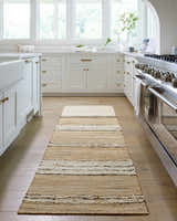 Bright kitchen scene with a tan and ivory striped Arnie Area Rug runner. Roomscene-Runner