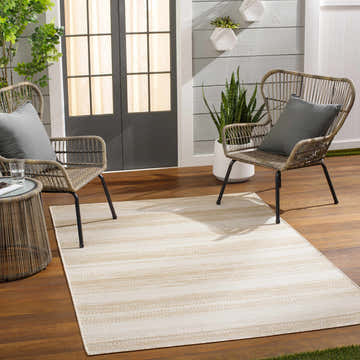 Outdoor patio scene with wicker chairs and a Kris Beige Area Rug. Roomscene-Rectangle