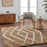 Living room scene with Allie Textured Jute Rug, wood cabinet, chair, and side table. Farmhouse style with natural tones. Roomscene-Rectangle