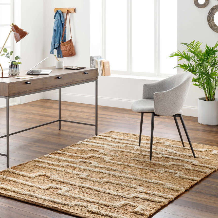 Home office with a jute Miya Area Rug, wood desk, gray chair, and natural light. Roomscene-Rectangle