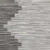 Close-up of the Shearwater Premium Rug. Hand-crafted hair-on-hide rug in beige, charcoal, cream, and gray hues. Swatch