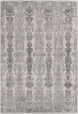 Close-up of the Shipdham Luxury Fringed Faux Silk Area Rug. Gray, charcoal, and black traditional pattern. Design-Rectangle