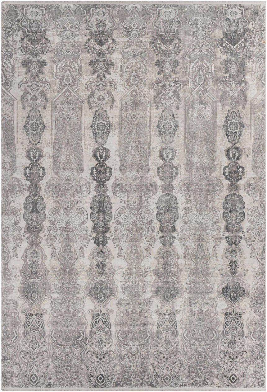 Close-up of the Shipdham Luxury Fringed Faux Silk Area Rug. Gray, charcoal, and black traditional pattern. Design-Rectangle