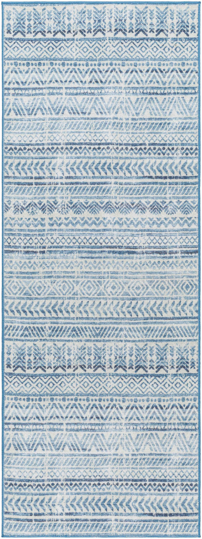 Close-up of the Ianna Arctic Stone Washable Area Rug featuring a blue and white geometric pattern. Farmhouse style. Design-Runner-2773