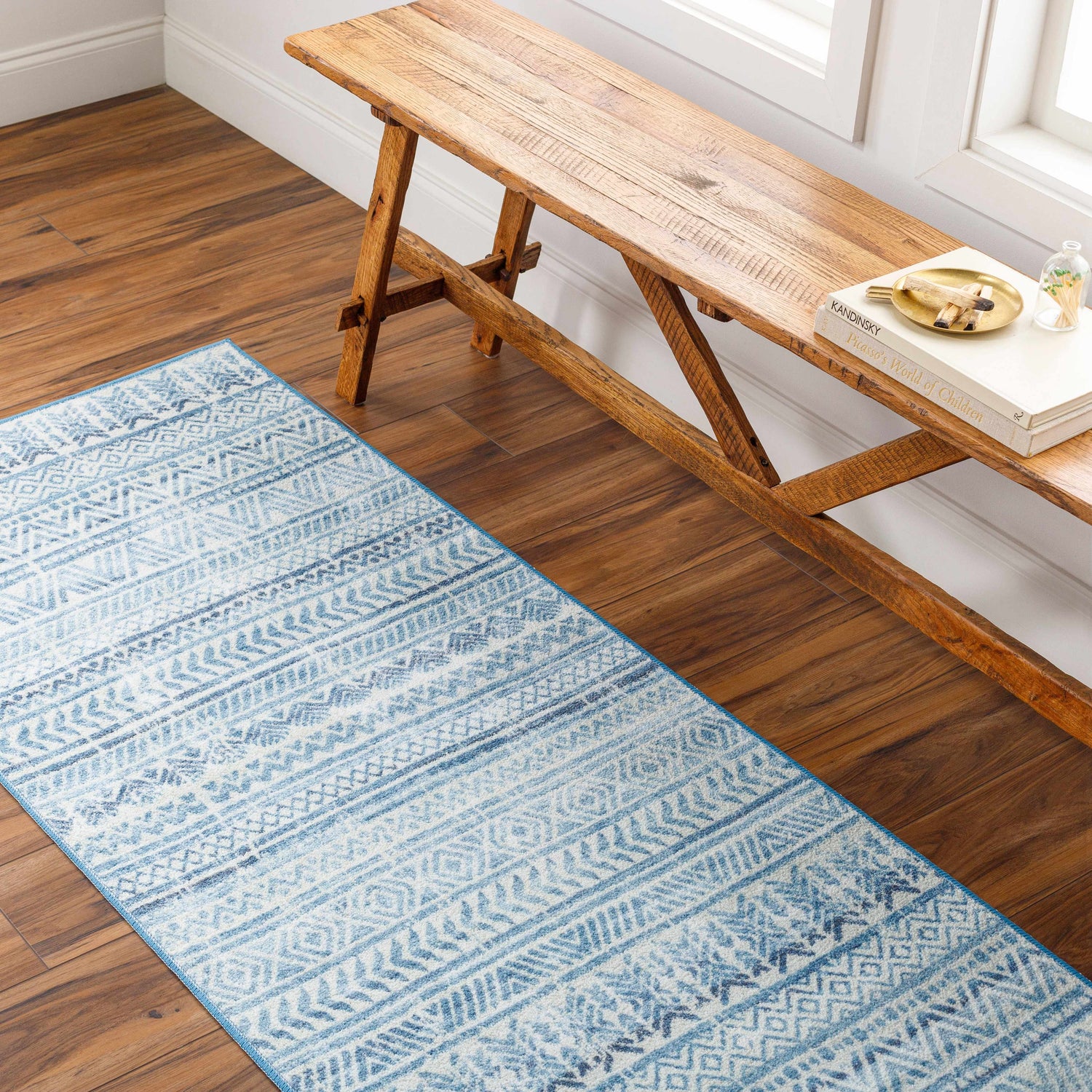 Entryway with wood floors and a rustic bench featuring the Ianna Arctic Stone Washable Area Rug runner. Roomscene-Runner