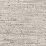 Close-up of Shortland Premium Area Rug. Hand-loomed cotton and viscose rug with a geometric gray and ivory pattern. Swatch