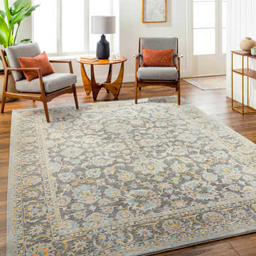 Living room scene with the Gefen Area Rug in gray, light blue, and orange floral pattern. Mid-century modern chairs and wood floors. Roomscene-Rectangle