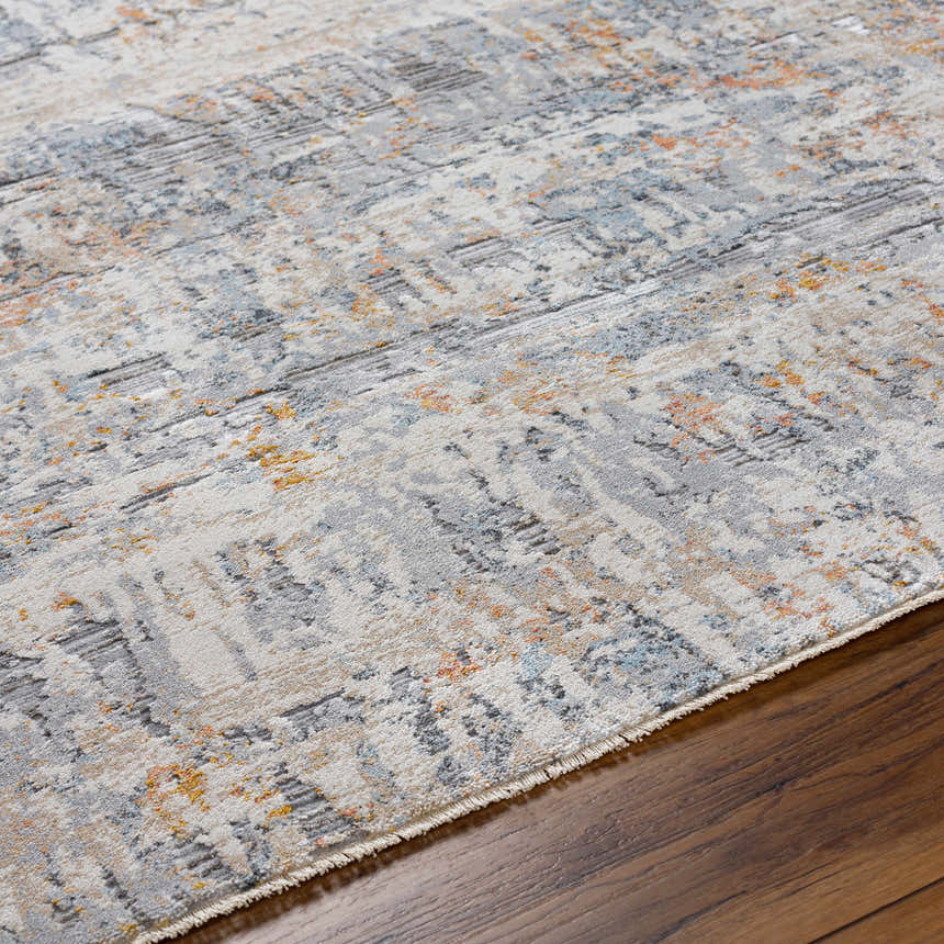 Close-up of the Guoda Area Rug: driftwood, gray, and nutmeg tones with a contemporary abstract design. Texture