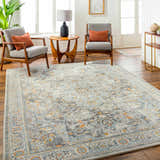 Living room scene with gray chairs and Hewez Area Rug in cloud gray, dark gray, and nutmeg. Roomscene-Rectangle