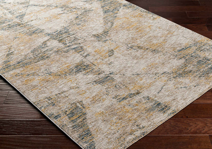 Close up of the Cadao Rich Textured Traditional Rug showing its light peach, mocha, and blue pattern. Corner