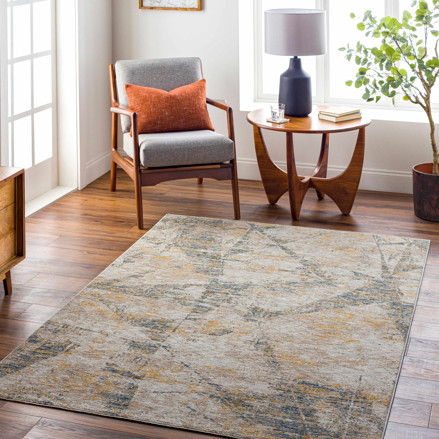 Living room scene with a Cadao Rich Textured Traditional Rug in light peach, mocha, and brown tones. Roomscene-Rectangle