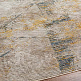 Close-up of the Cadao Rich Textured Traditional Rug, showcasing its light peach, mocha, blue and multi-brown tones. Texture